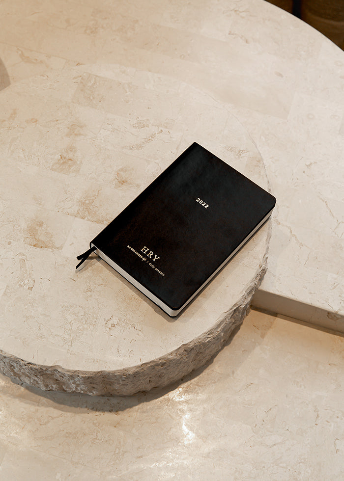 An Organised Life Black Leather Diary on a marble table 
